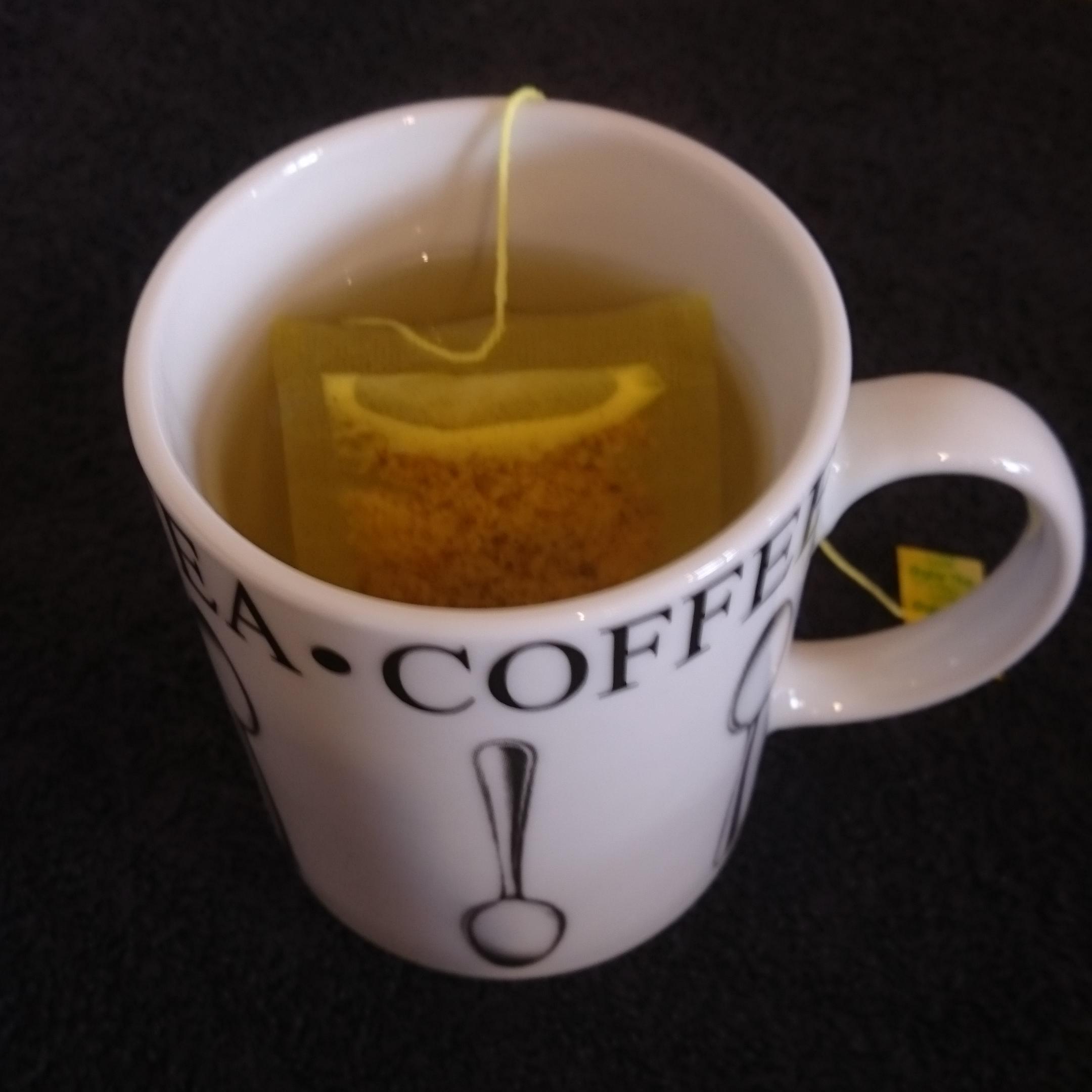 Natur Boutique's Coconut Tea with Ginger and Turmeric teabag in
cup